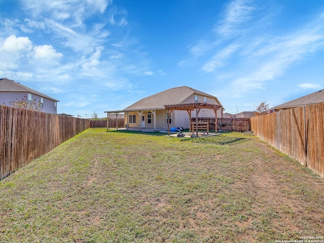 view of yard with a pergola and a patio