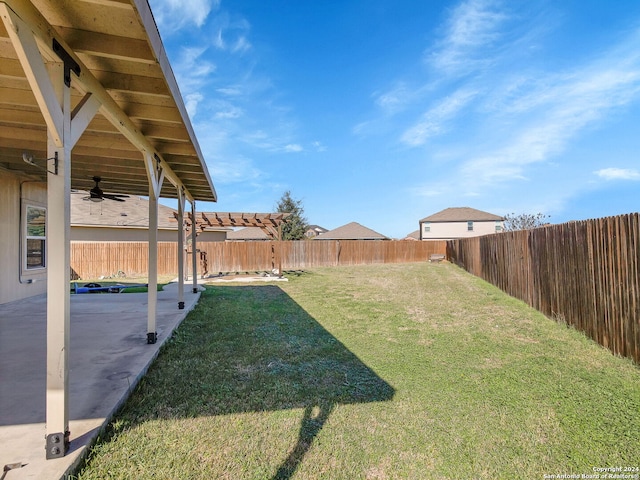 view of yard with a patio and ceiling fan