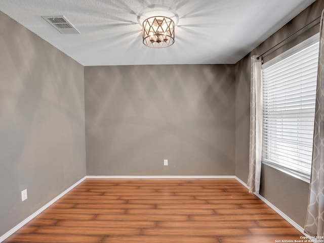 spare room featuring hardwood / wood-style floors