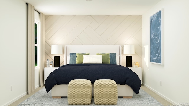 bedroom with light colored carpet and wooden walls