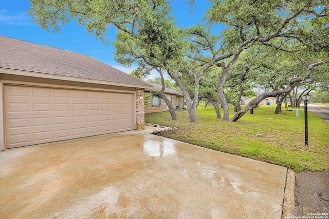 garage with a yard