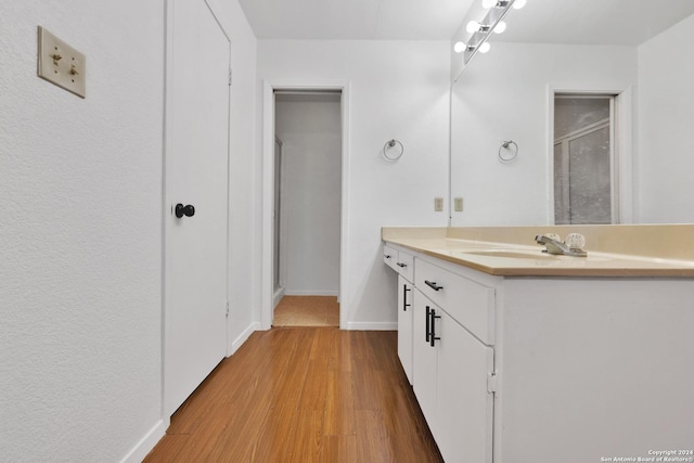 bathroom featuring vanity and hardwood / wood-style flooring