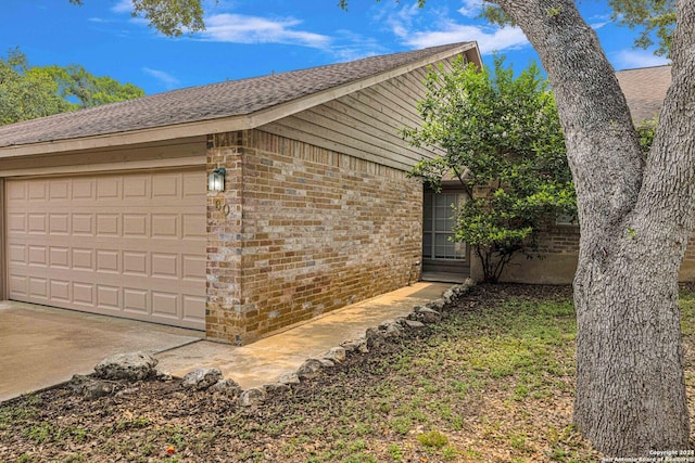 view of side of property with a garage