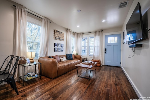 living room with dark hardwood / wood-style floors