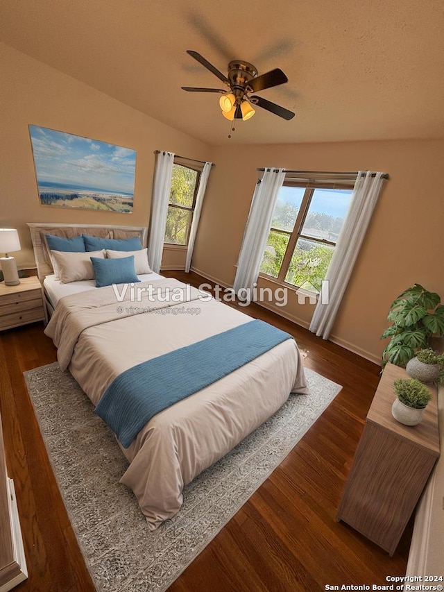 bedroom featuring dark hardwood / wood-style flooring and ceiling fan