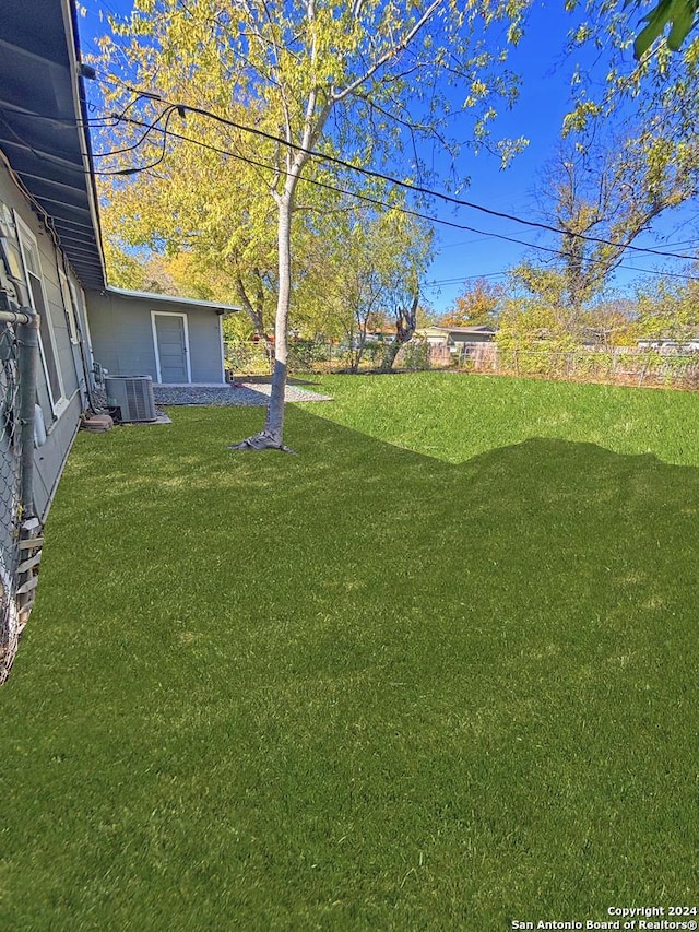 view of yard featuring central AC