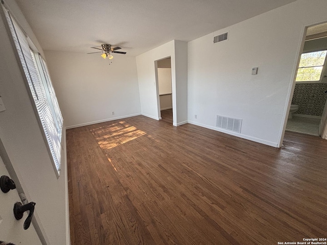 interior space with ceiling fan and dark hardwood / wood-style floors