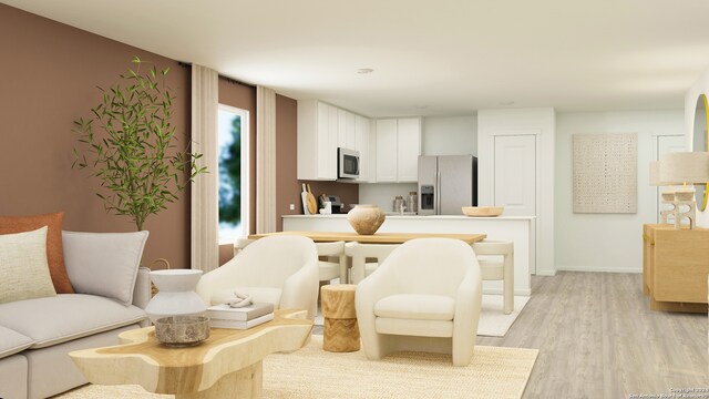 kitchen with white cabinets, appliances with stainless steel finishes, and light hardwood / wood-style floors