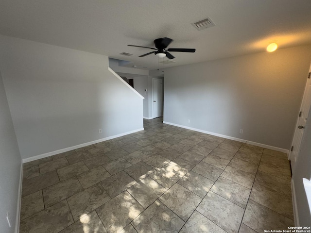 spare room with ceiling fan