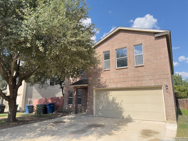 front of property with a garage