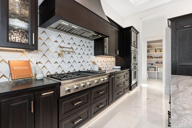 kitchen with premium range hood, backsplash, and stainless steel appliances