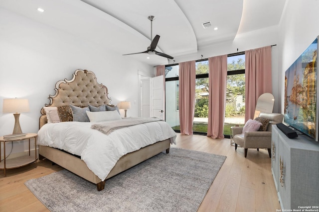 bedroom featuring light hardwood / wood-style floors and ceiling fan