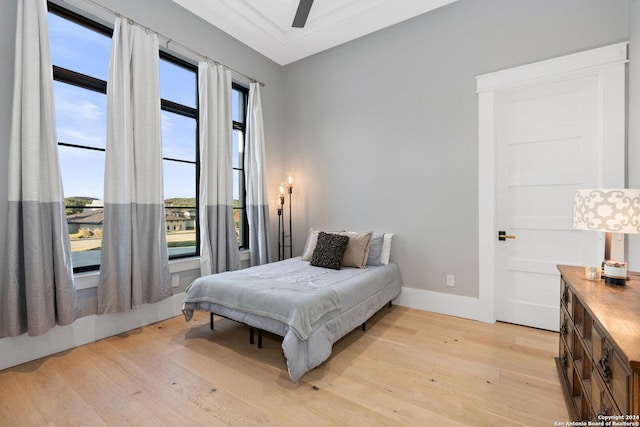 bedroom featuring light hardwood / wood-style floors and ceiling fan