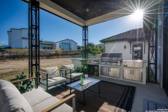 view of patio with grilling area, outdoor lounge area, and area for grilling