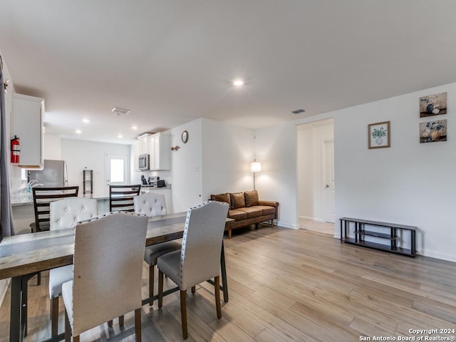 dining room featuring light hardwood / wood-style floors