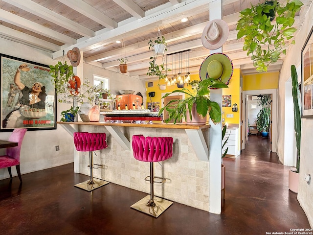 bar featuring beam ceiling and wooden ceiling