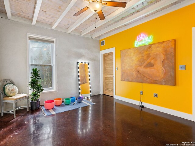 workout room with ceiling fan and wood ceiling