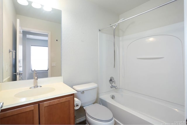 full bathroom featuring vanity,  shower combination, and toilet