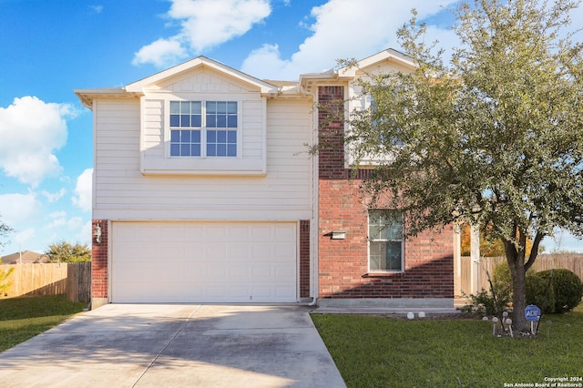 view of front facade featuring fence, an attached garage, concrete driveway, a front lawn, and brick siding