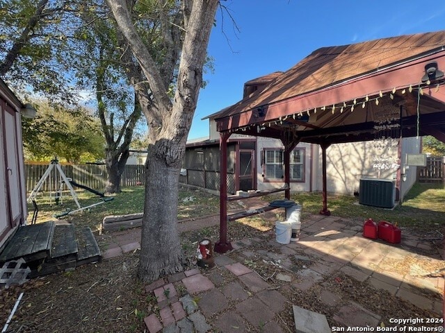 view of patio featuring a gazebo and central AC unit