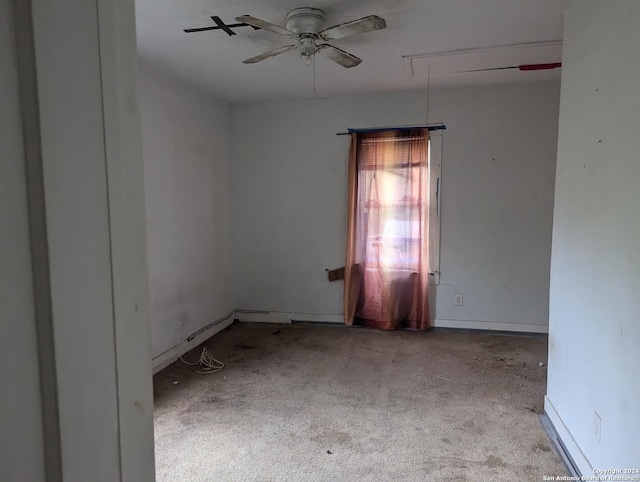 carpeted empty room with ceiling fan