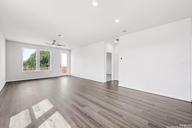 empty room with visible vents, recessed lighting, a ceiling fan, and wood finished floors