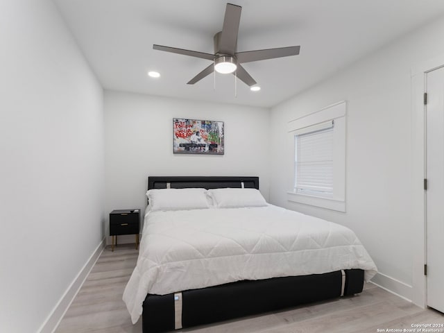 bedroom featuring ceiling fan and light hardwood / wood-style floors