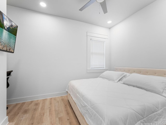 bedroom featuring hardwood / wood-style flooring and ceiling fan