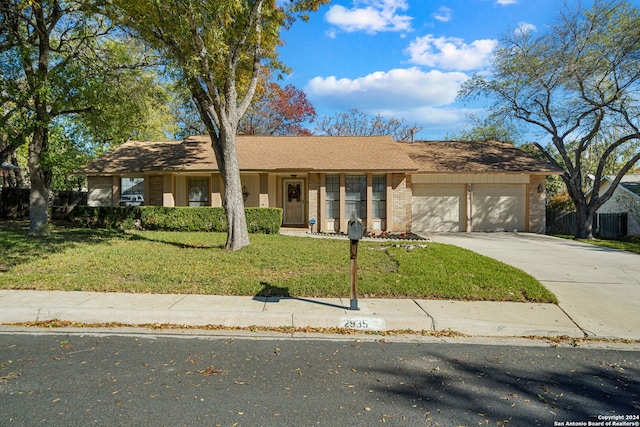 single story home with a front lawn and a garage