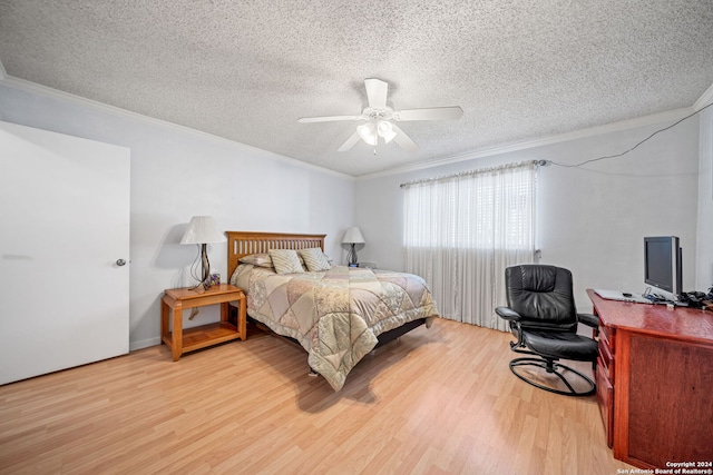 bedroom with wood-type flooring, a textured ceiling, ceiling fan, and crown molding