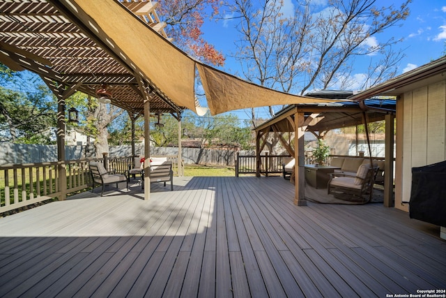 wooden terrace with outdoor lounge area and a pergola