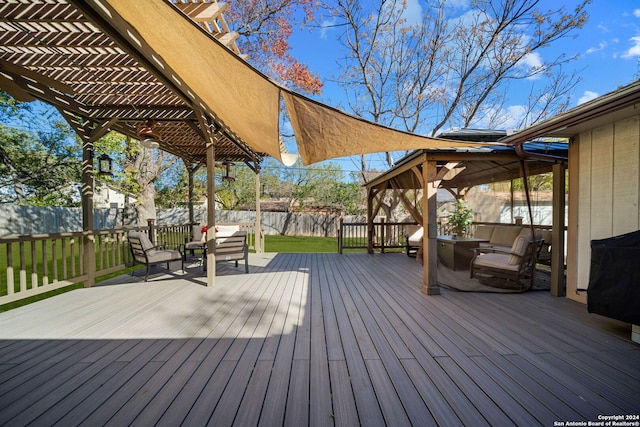 deck with an outdoor living space, a pergola, and a lawn