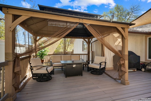 wooden terrace featuring a gazebo and an outdoor hangout area