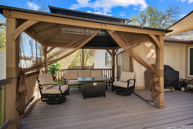 wooden terrace with outdoor lounge area and a gazebo