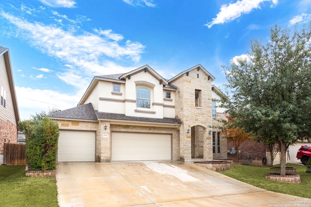 view of front facade featuring a garage and a front yard