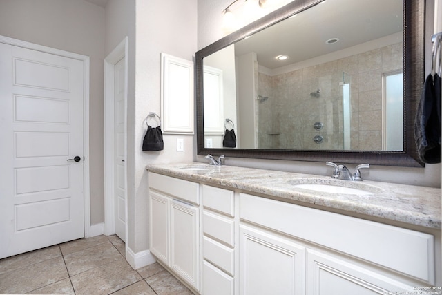 bathroom featuring vanity, tile patterned floors, an enclosed shower, and a healthy amount of sunlight