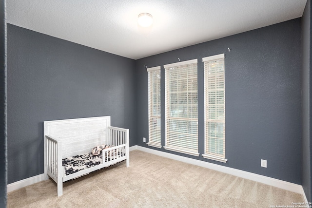 unfurnished bedroom with carpet flooring