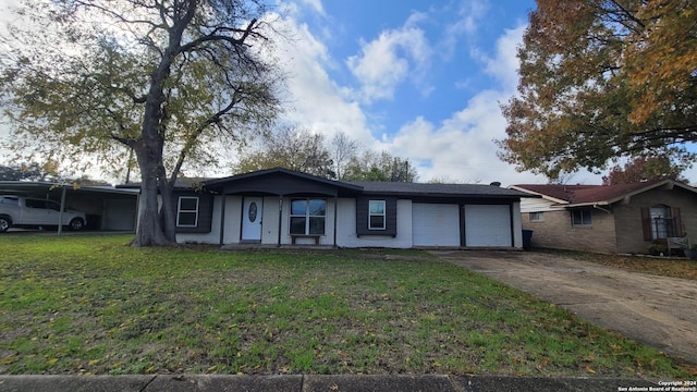 ranch-style home with a front yard and a garage