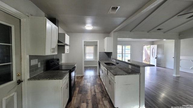 kitchen featuring decorative backsplash, black electric range oven, white cabinetry, and dark stone counters