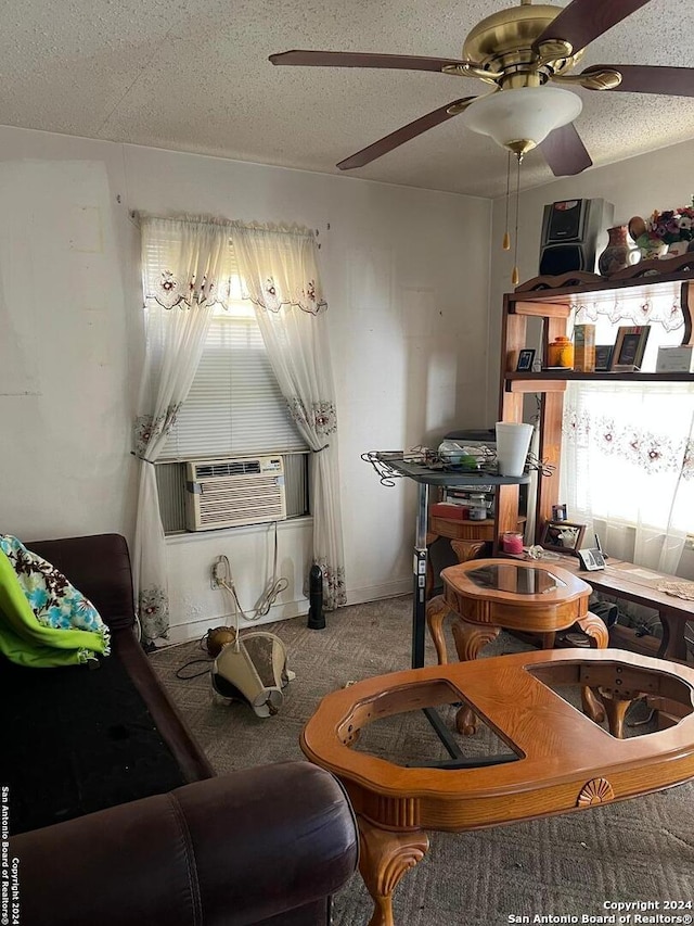 carpeted living room featuring cooling unit and a textured ceiling