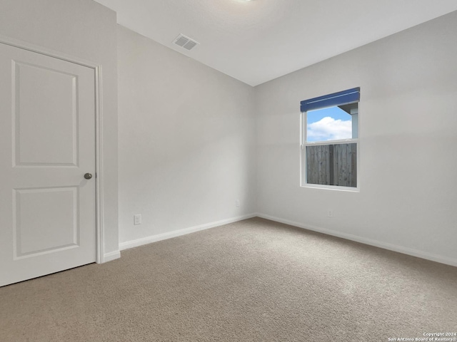 empty room with carpet flooring