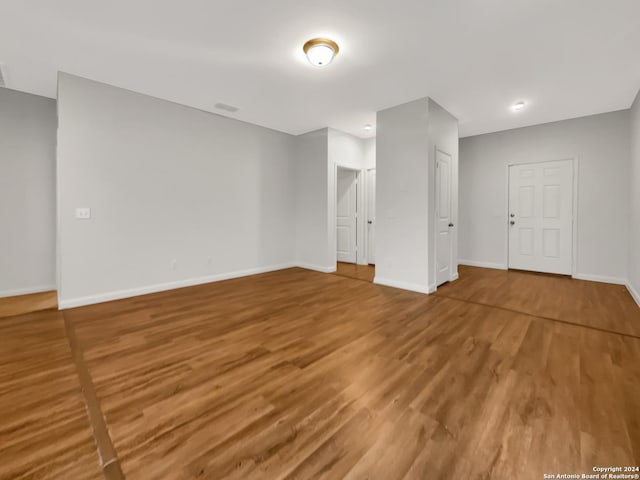 empty room featuring hardwood / wood-style flooring