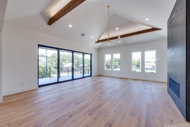 unfurnished living room with high vaulted ceiling, light wood-type flooring, beamed ceiling, a large fireplace, and a chandelier