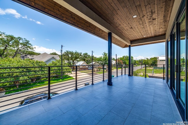 view of patio featuring a balcony