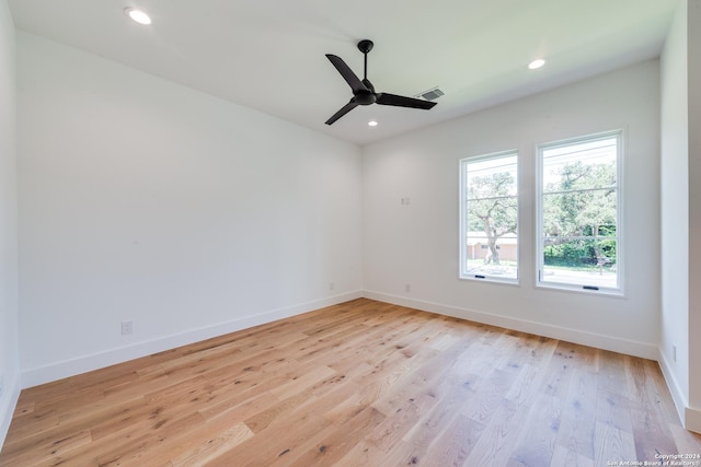 unfurnished room featuring light wood-type flooring and ceiling fan