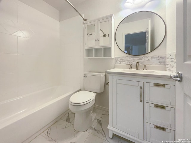 full bathroom with vanity, tiled shower / bath combo, and toilet