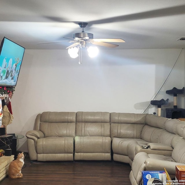 living room featuring dark hardwood / wood-style floors and ceiling fan