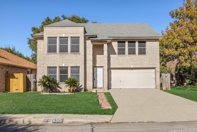 view of front facade featuring a garage and a front yard