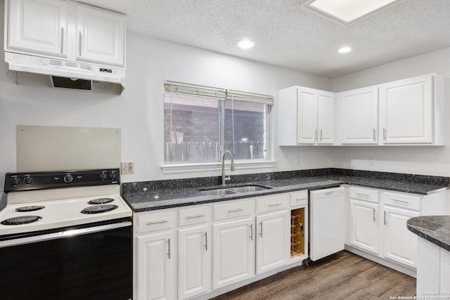 kitchen featuring white appliances, white cabinetry, dark wood-type flooring, and sink