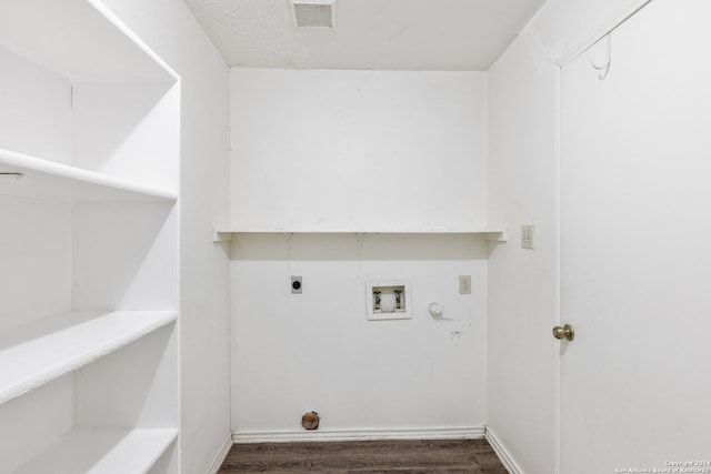 clothes washing area featuring hookup for an electric dryer, hookup for a washing machine, and dark hardwood / wood-style flooring